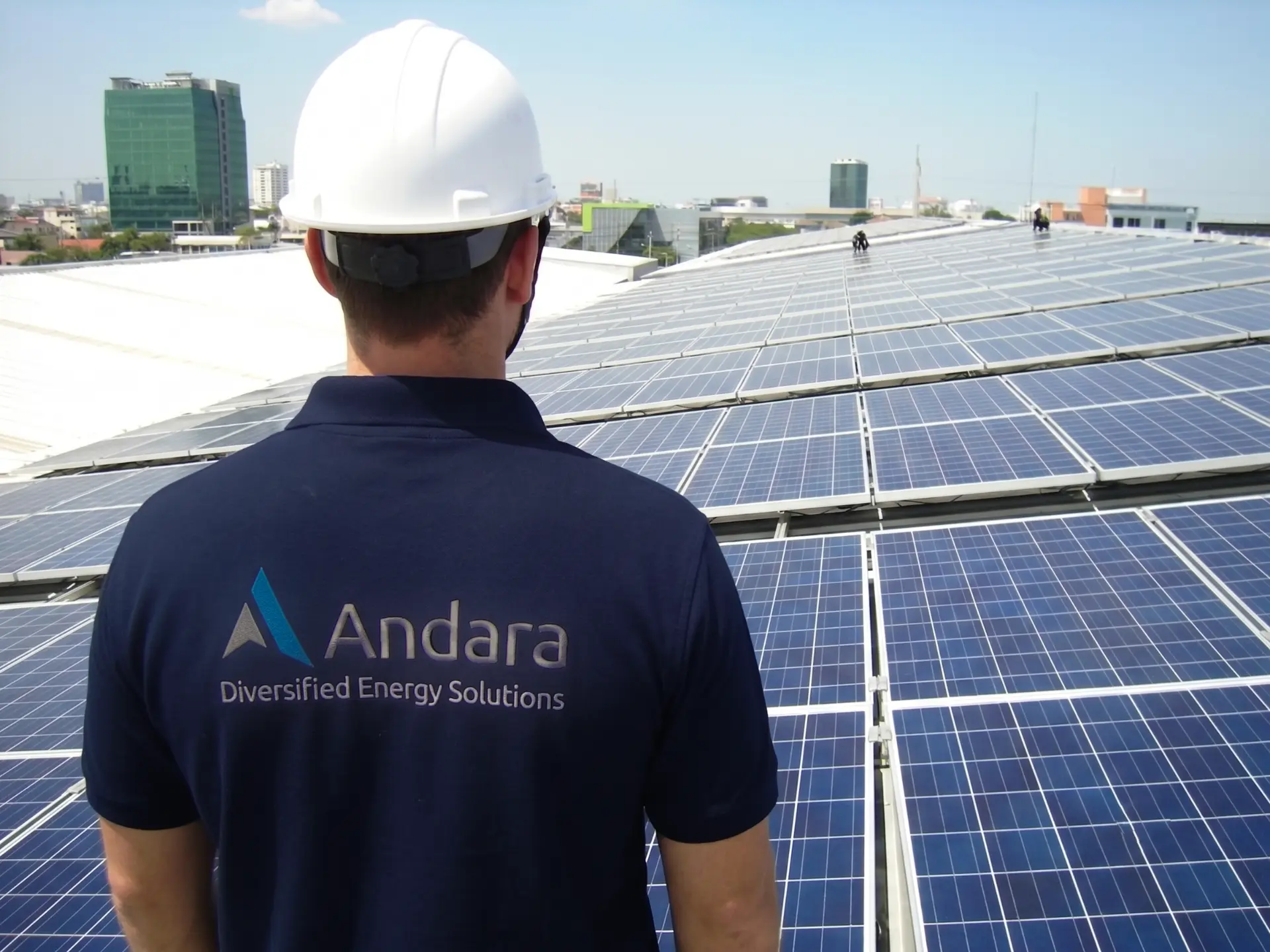 technicians installing equipment on a rooftop array